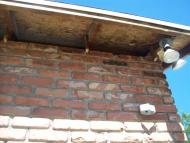 Exterior brick with smoke stains.